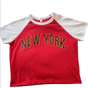 Crop top with red and white and has New York on front